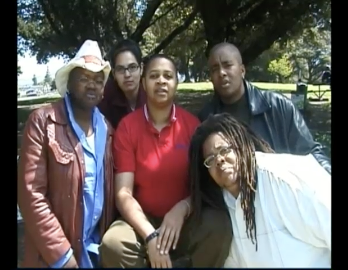 A butch and trans performance art group called Other Brothers stand outside together