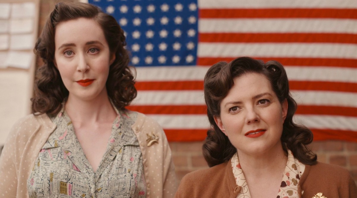 A League of Their Own recap: two white women make evil looking smiles while standing in front of an American flag