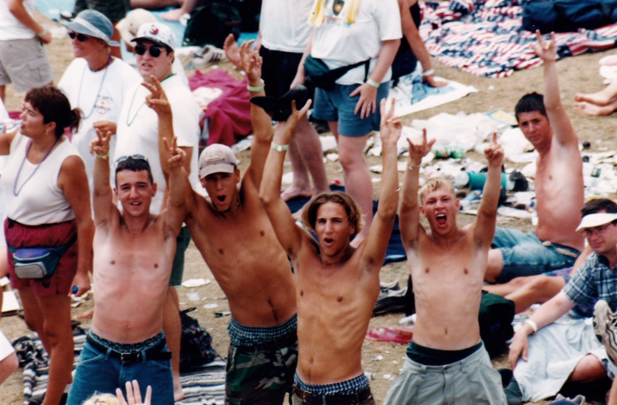 White men yelling in joy at Woodstock 99