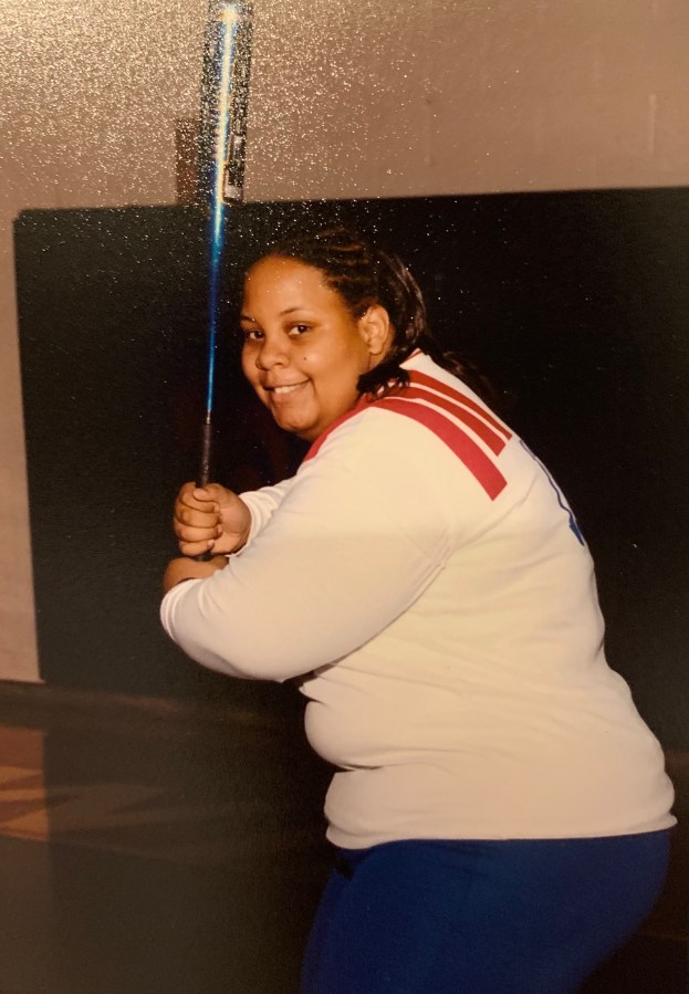 shea wesley martin as a young child holding a baseball bat