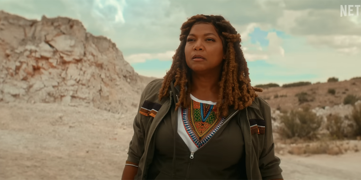 Queen Latifah stands in the desert in End of the Road