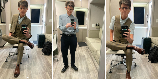 Tig Notaro takes mirror selfies in a trailer while wearing a three-piece suit.