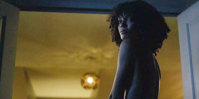 A naked Kathy (Maisie Richardson-Sellers) looks back at Saara after she's forced out of bed after their night together)