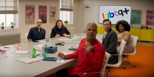 Miss Lawrence, Billy Eichner, Ts Madison, Jim Rash, and Dot-Marie Jones sit around a conference table and all look off camera surprised. Behind them reads The National Museum of lgbtq+ History and Culture.