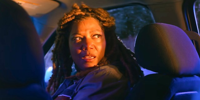 Queen Latifah's End of the Road review: Queen Latifah is in a car terrified in the middle of the night, looking to the right of camera, she has faux dreadlocks in her hair.
