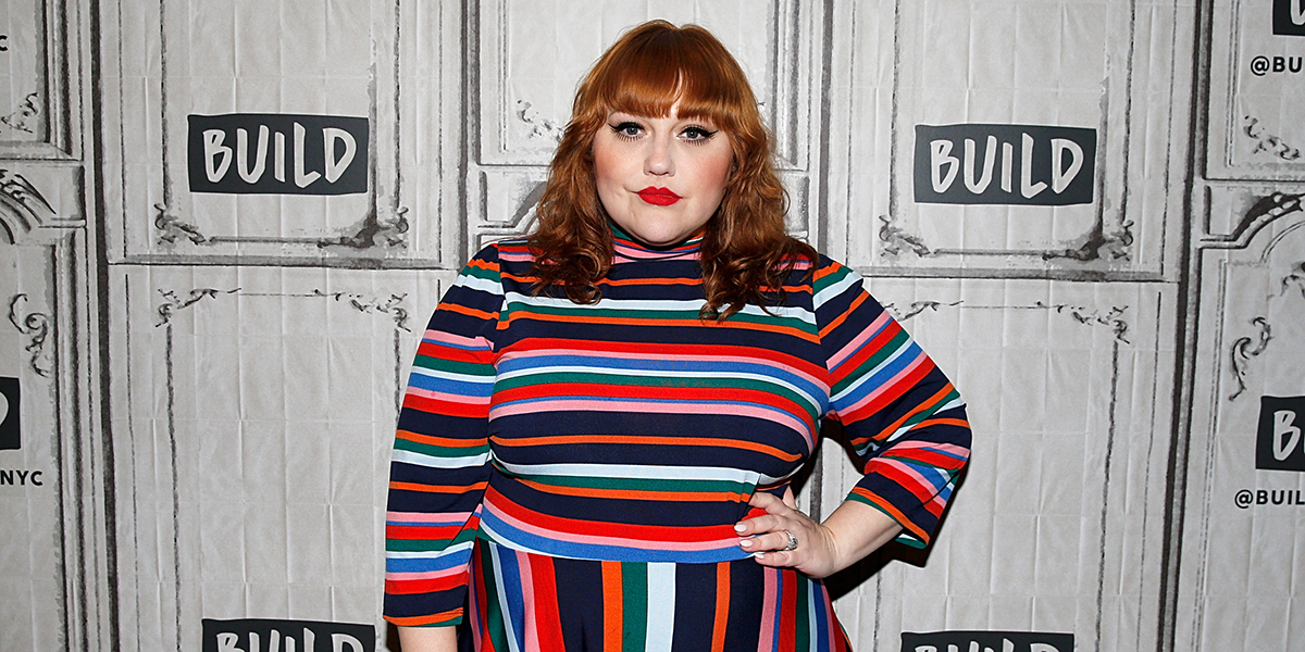 Beth Ditto in a striped dress on the red carpet