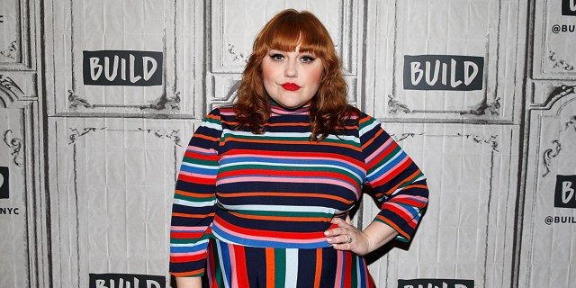 Beth Ditto in a striped dress on the red carpet