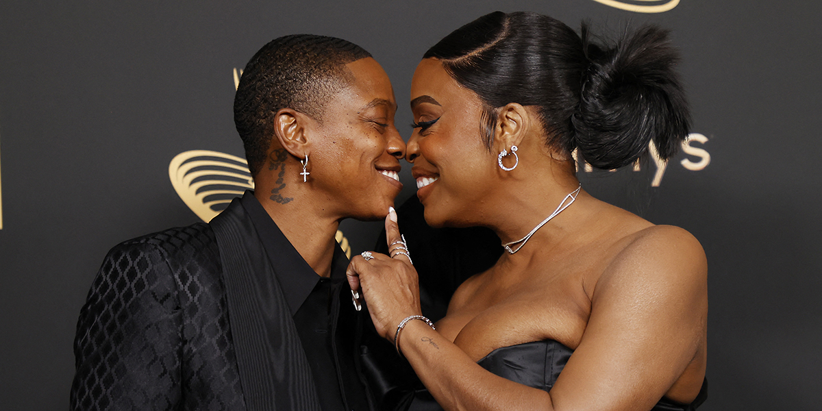 Niecy Nash and Jessica Betts boop noses on the red carpet