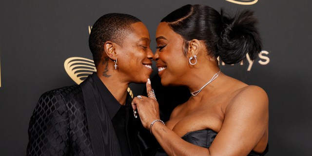 Niecy Nash and Jessica Betts boop noses on the red carpet