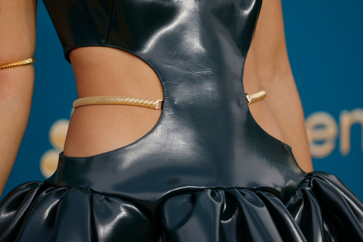 A close-up of the cutouts of Jasmin Savoy Brown's waist dress.