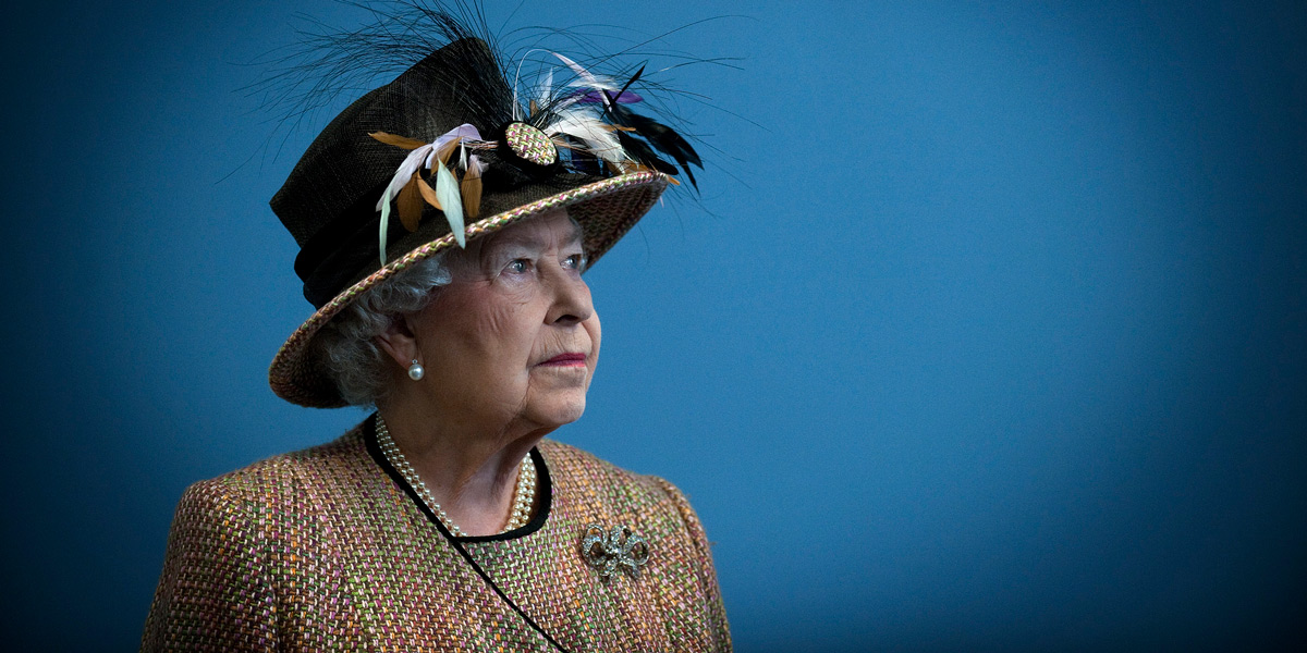 A portrait of Queen Elizabeth looking off to the right, in a large hat, against a blue background