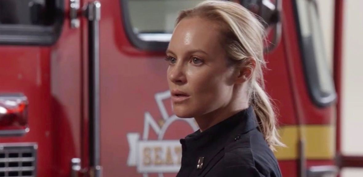 Maya Bishop in her uniform in front of a fire truck on Station 19