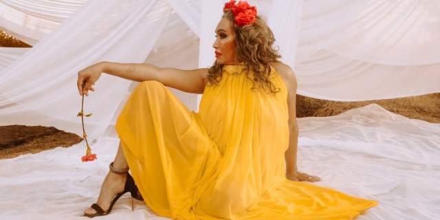 Cecilia Gentili in a yellow dress