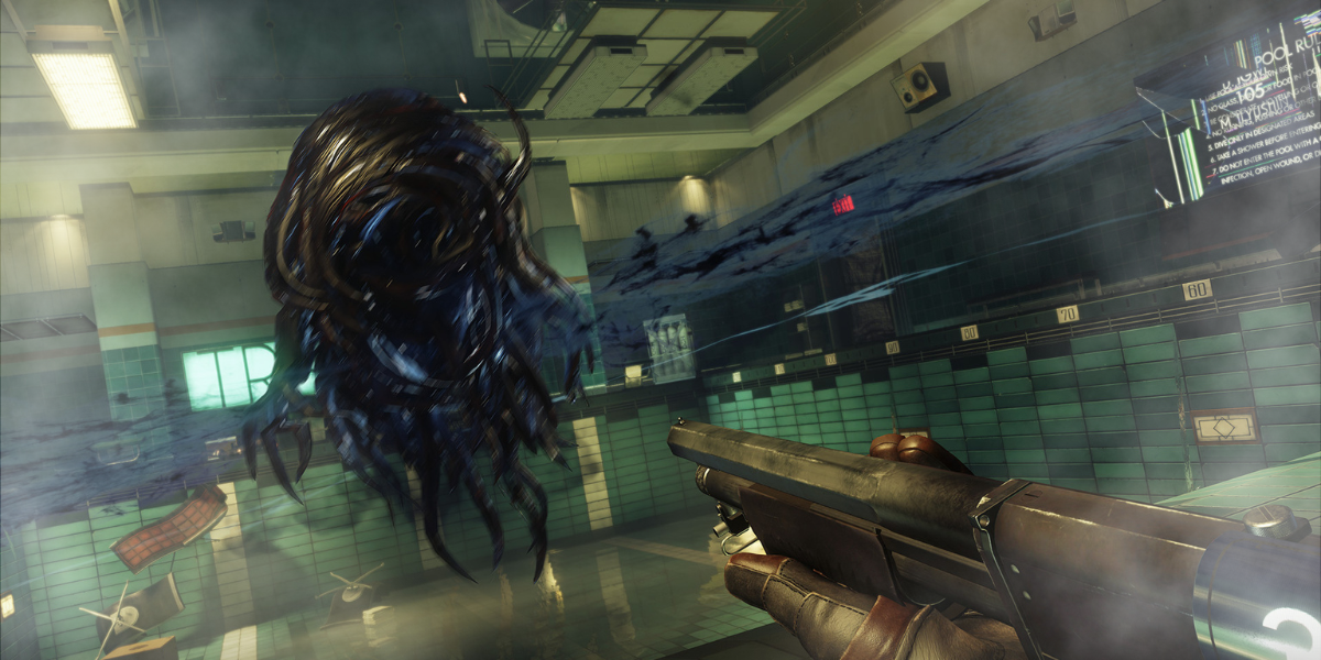 A gun is aimed at a tentacled alien in the video game Prey