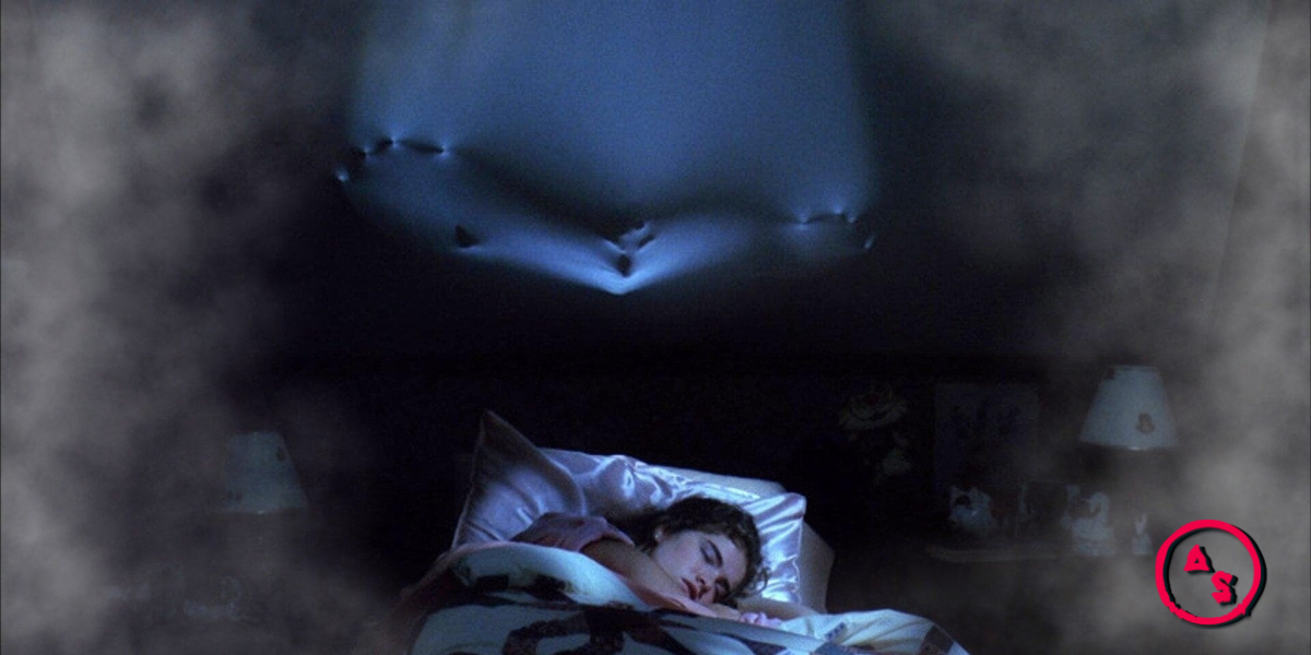 Nancy in Nightmare on Elm Street sleeps while something presses through the ceiling.