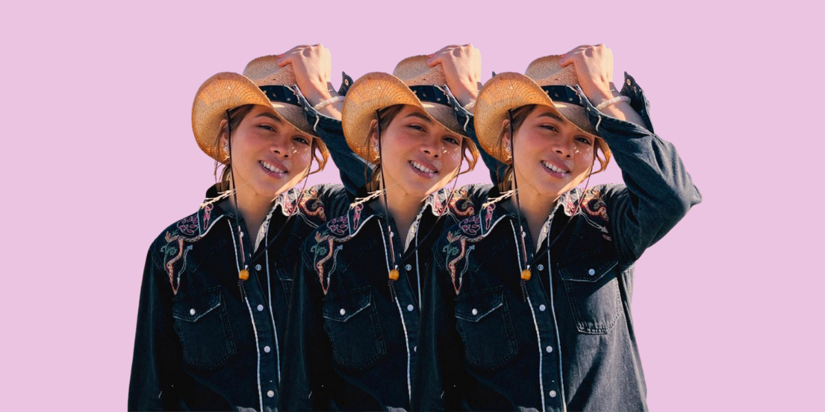 Hayley Kiyoko wears a cowboy hat and a western style buttondown while smiling