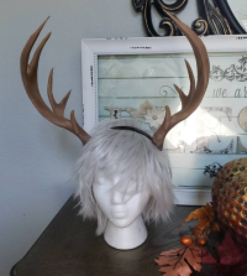 A pair of antlers on a mannequin head