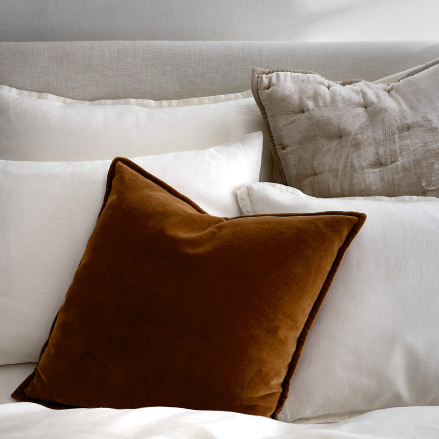 A Cognac-colored throw pillow