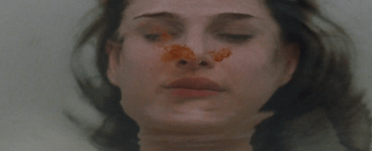 Nina is underwater in the bath and blood drops fall down in Black Swan