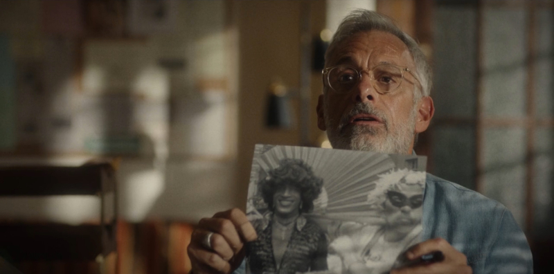 Joe Mantello holds up a black and white photo of Marsha P. Johnson.