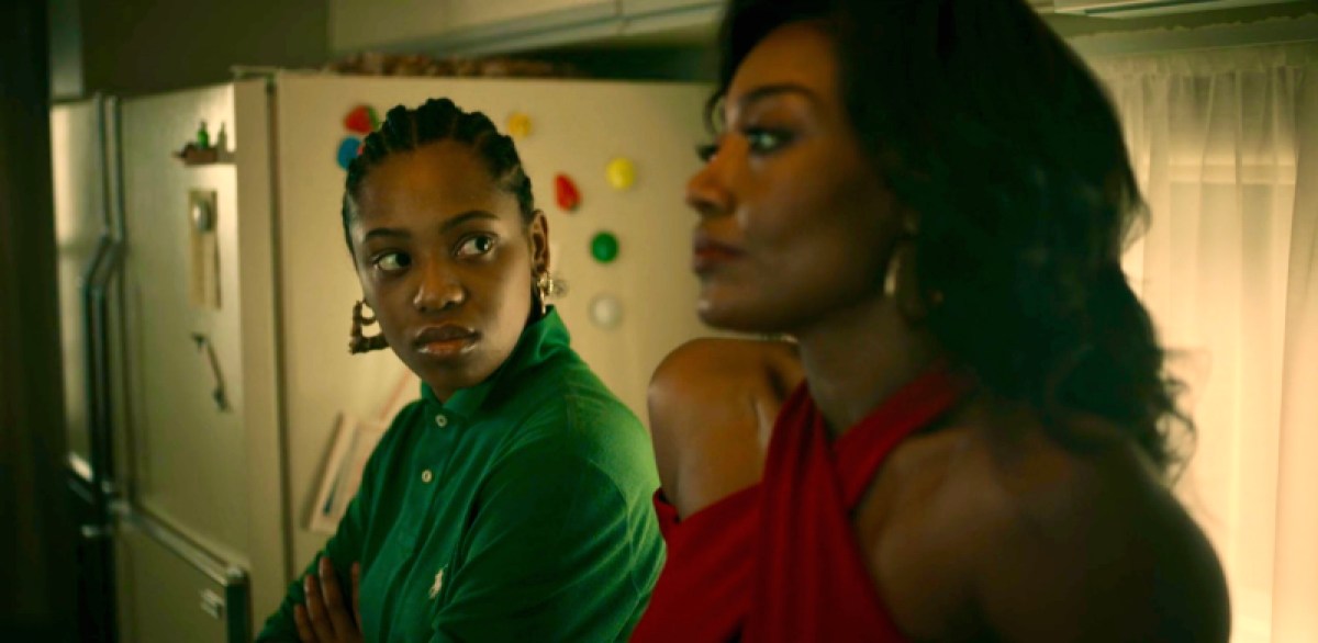 Jukebox stares at her Aunt Raquel in the kitchen