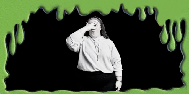 The background is black. Green slime trickles down from the border of the image. In the center, there is a black and white photo of a curvy white woman in dark leggings and a light sweatshirt. She wears a headhunt in her long hair and covers her face with one hand and looks embarrassed.
