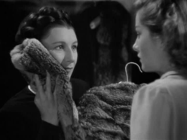 Mrs. Danvers rubs a fur coat against her face in Rebecca