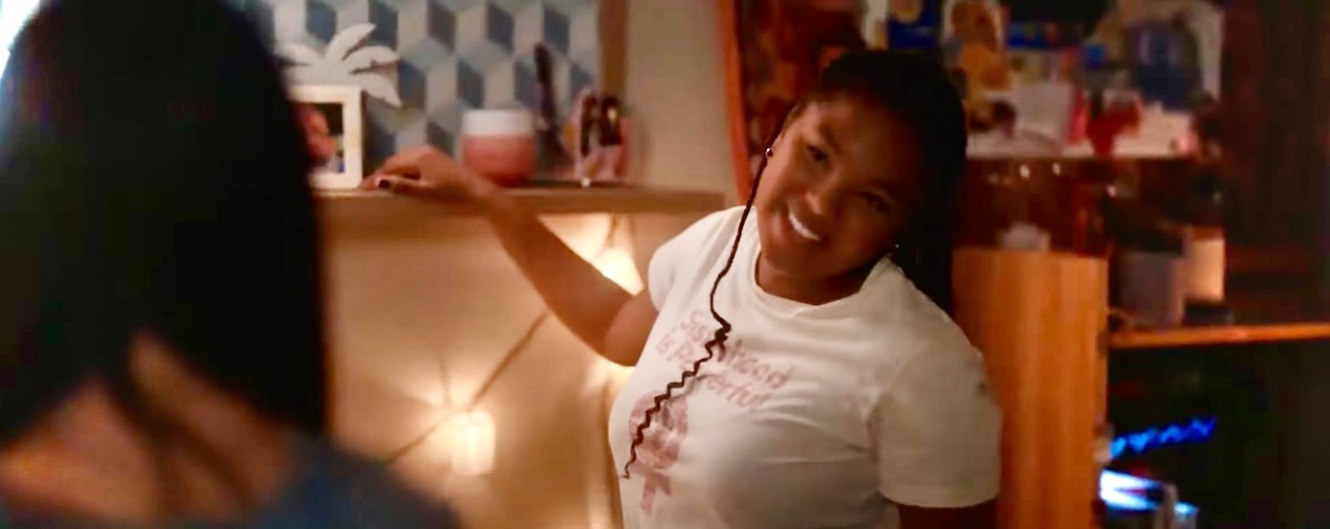 Angie in a t-shirt that says SISTERHOOD IS POWERFUL