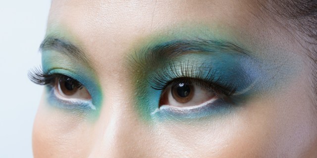 close up of a person's eyes, with gorgeous blue and green eye shadow