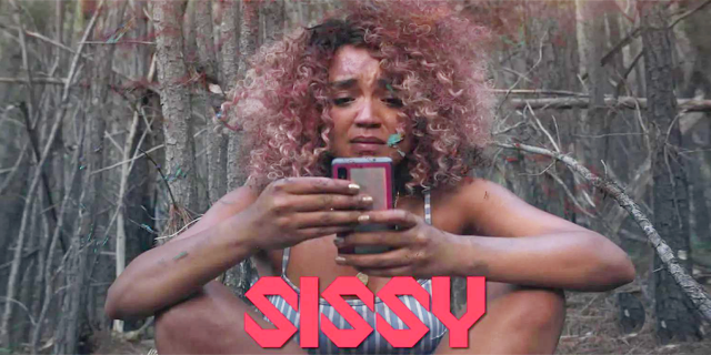 Aisha Dee in the woods on her phone. SISSY in red letters.