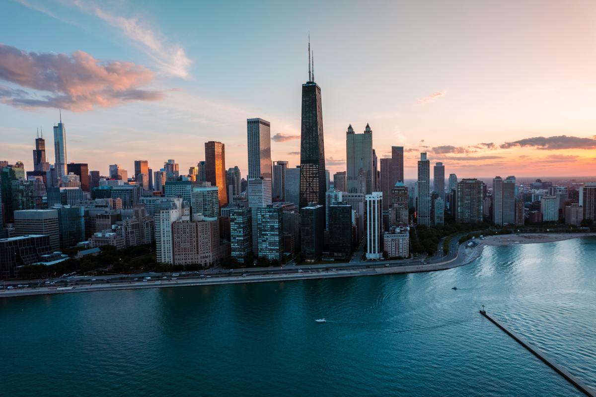 The Chicago skyline, next to the lake, as the sun sets