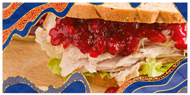 A leftover Thanksgiving sandwich with cranberry sauce and turkey on it.