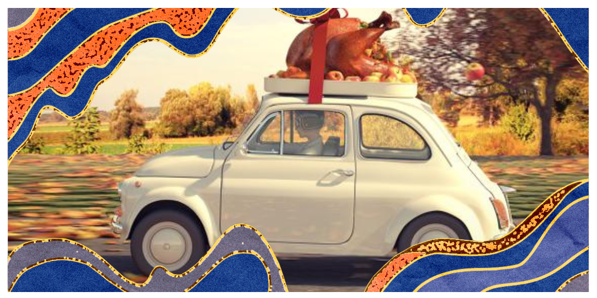 A comically large turkey strapped to the top of a vintage car in front of an autumn background