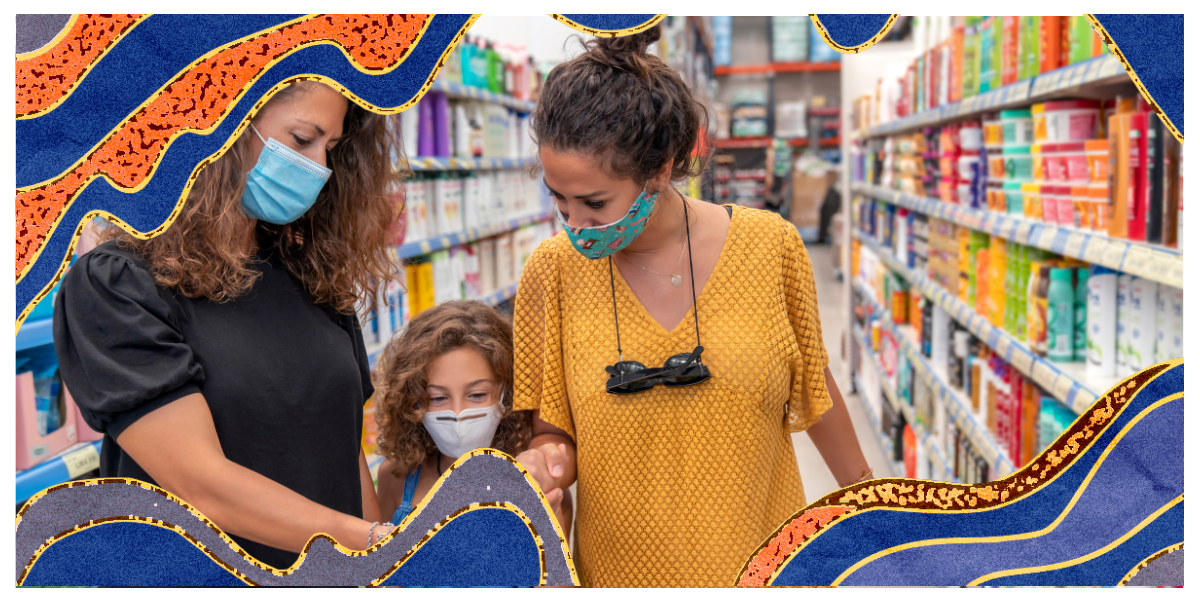 Two moms and their daughter shop at the supermarket