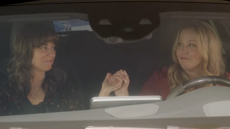 Judy and Jen hold hands in the car, Thelma and Louise style