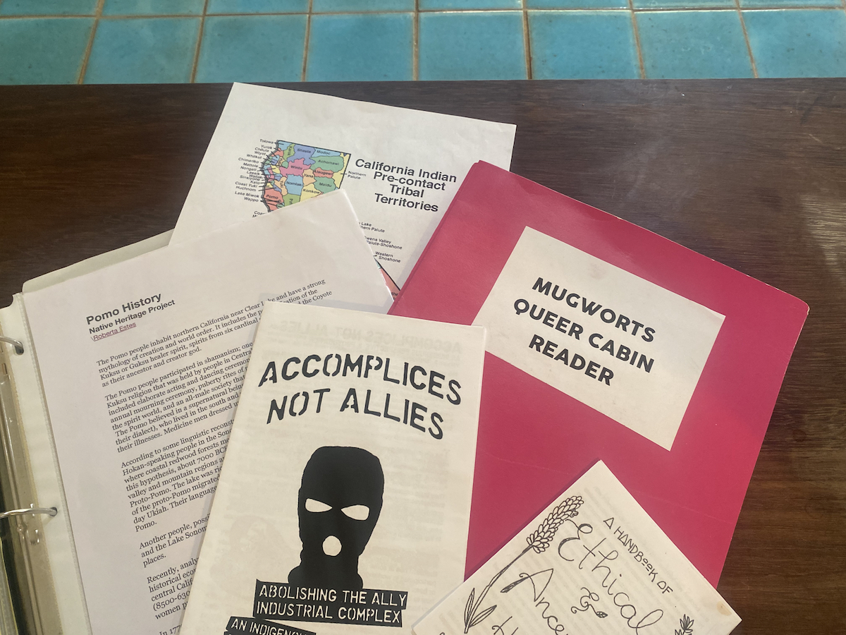 Mugworts Documents — a zine titled ACCOMPLICES NOT ALLIES, a folder titles MUGWORTS QUEER CABIN READER, a page with a map of Indigenous Land in the area, a page with the Pomo History from Native Heritage Project 