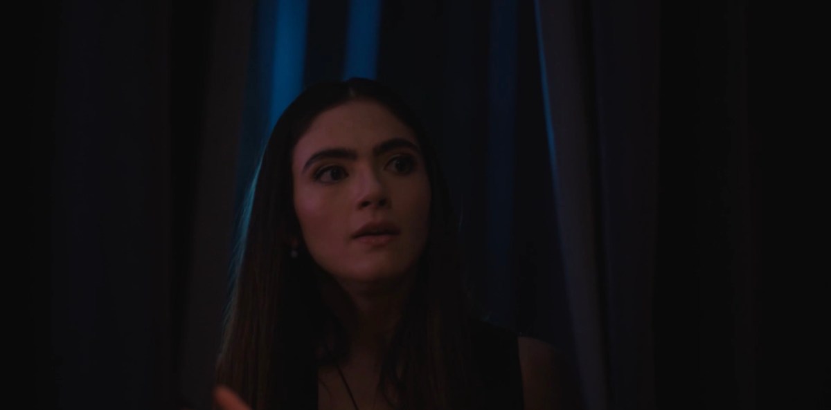 Dani looking through the curtain