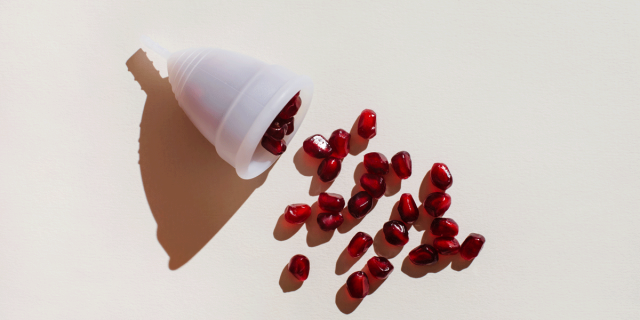 Pomegranate seeds pour out of the menstrual cup