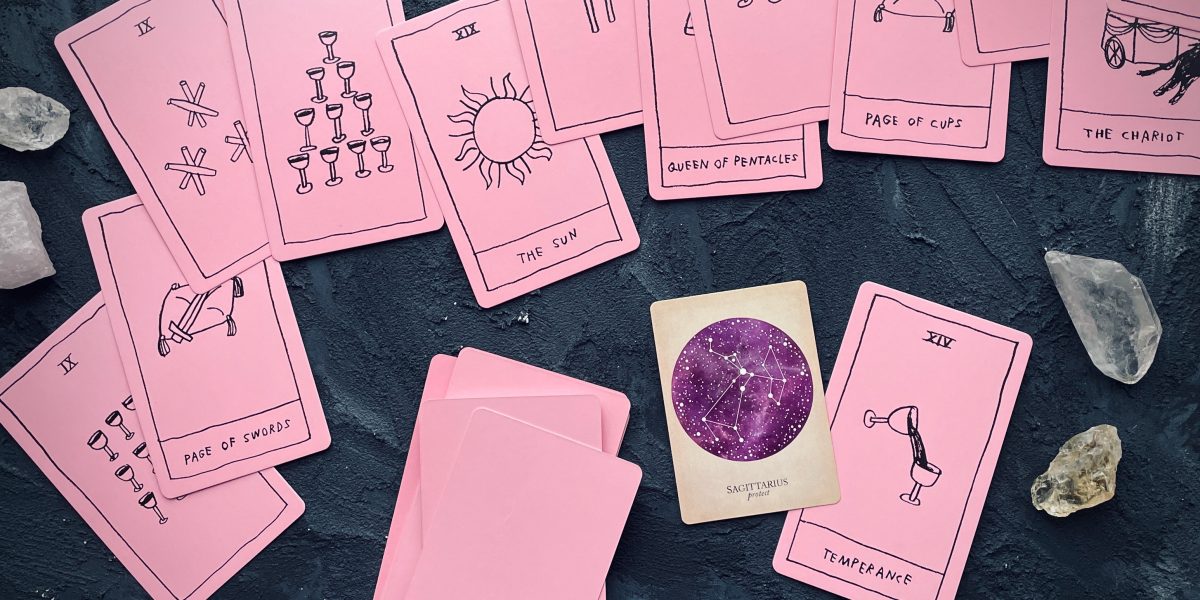 cards from the OK tarot (they are bright pink) and the sagittarius card from the compendium of constellations
