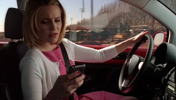 Quinn Fabray looking at her phone while drivng