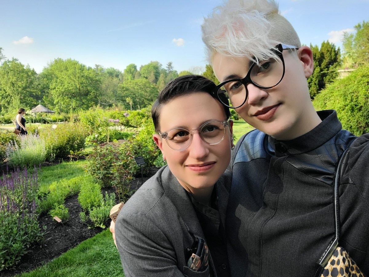 Nico and Sadie are all dressed up and in a botanic garden