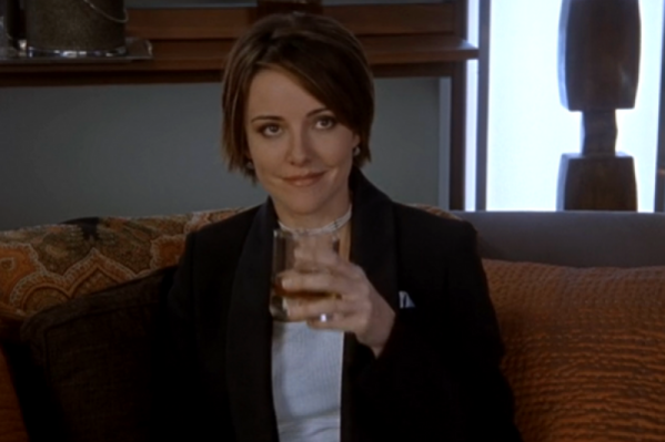Jordan Sullivan on Scrubs with a glass in her hand