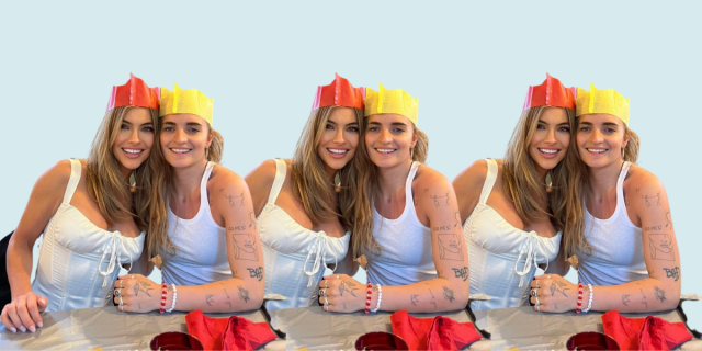 Chrishell Stause and G Flip celebrating Christmas together, wearing orange and yellow paper crowns respectively
