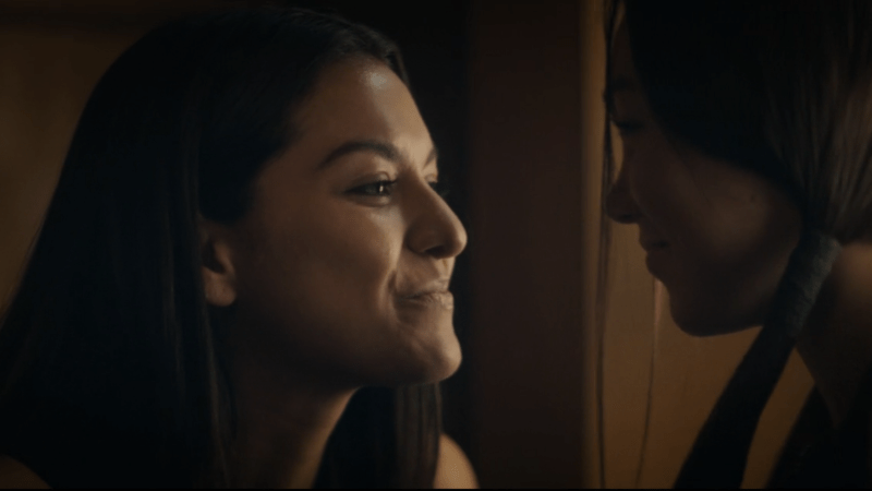 The 100 Best Lesbian Sci-Fi Fantasy TV Shows: The 100 Best Lesbian Sci-Fi Fantasy TV Shows: Utopia Falls screenshot: Brooklyn and Sage exchange sweet smiley looks