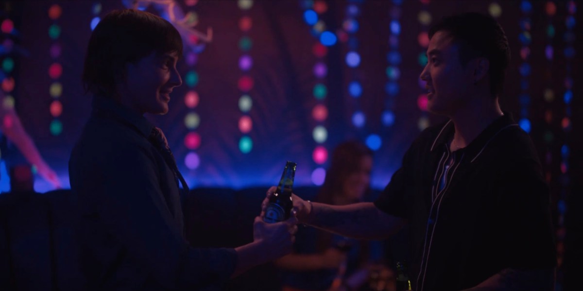 Micah and Max holding the same beer at Dana's