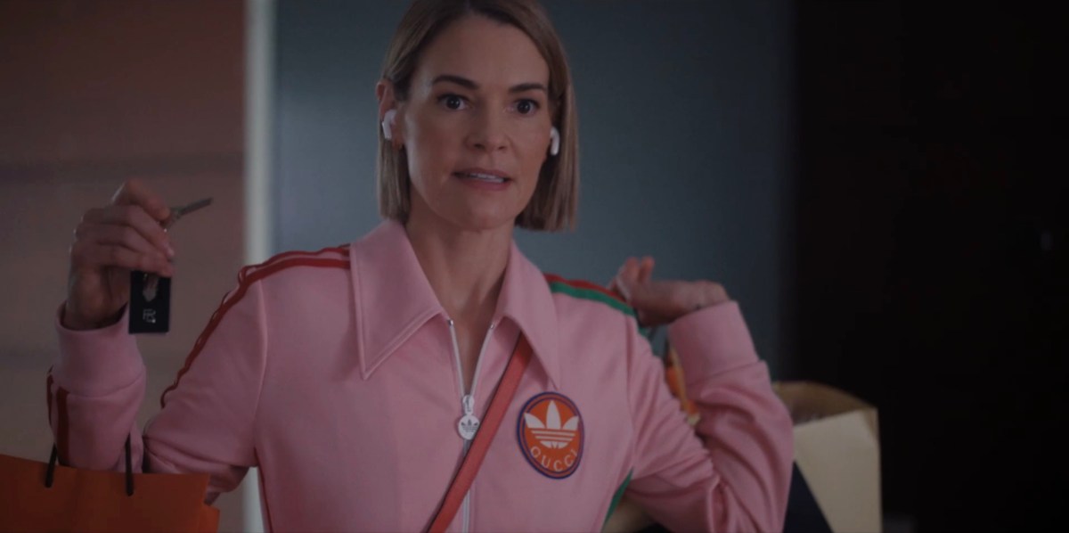 Alice in her cute pink tracksuit holding 