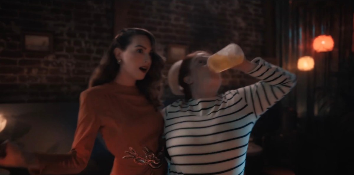 A sailor chugging a beer with her arm around Tess who is like "oh!"