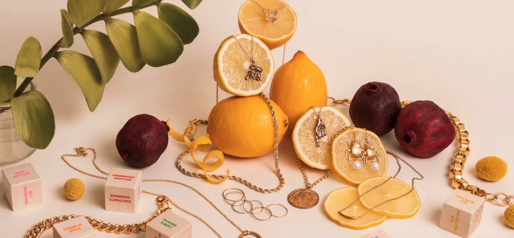 fruit posed with jewelry