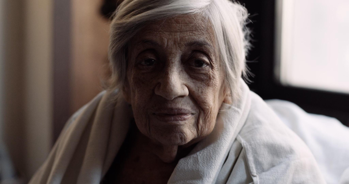 Shatzi Wesiberger, known as The People's Bubbie, at home in her Upper West Side apartment. This is a stunning portrait — her face takes up the whole frame and she looks at the camera head on, not smiling, simply existing.