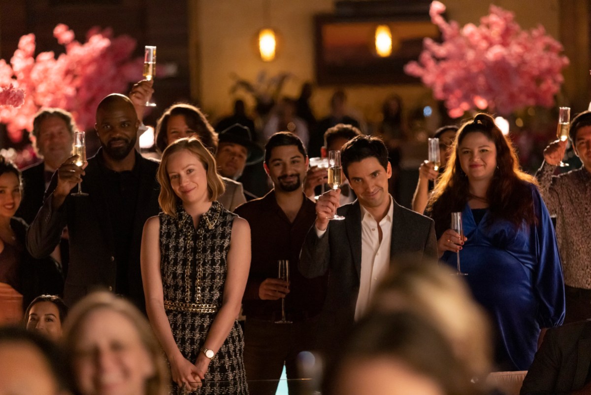 Hacks' team toasting at a night party